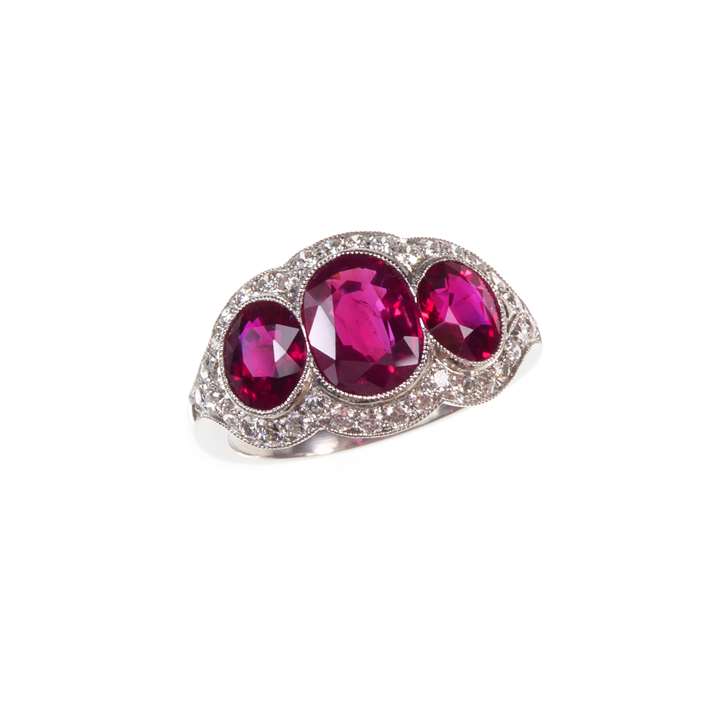 Three stone ruby and diamond line cluster ring